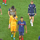 France walks off the pitch, heads down.